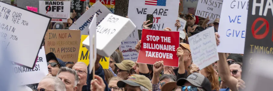 Stop the Billionaire Takeover Sign at a rally in Austin