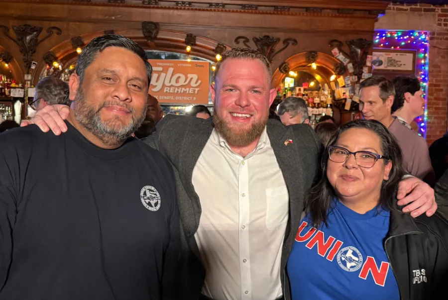 Texas AFL-CIO President Leonard Aguilar and Texas AFL-CIO Secretary-Treasurer Lorraine Montemayor flank Senator-elect for SD 9 Taylor Rehmet at his Jan. 31 election night party
